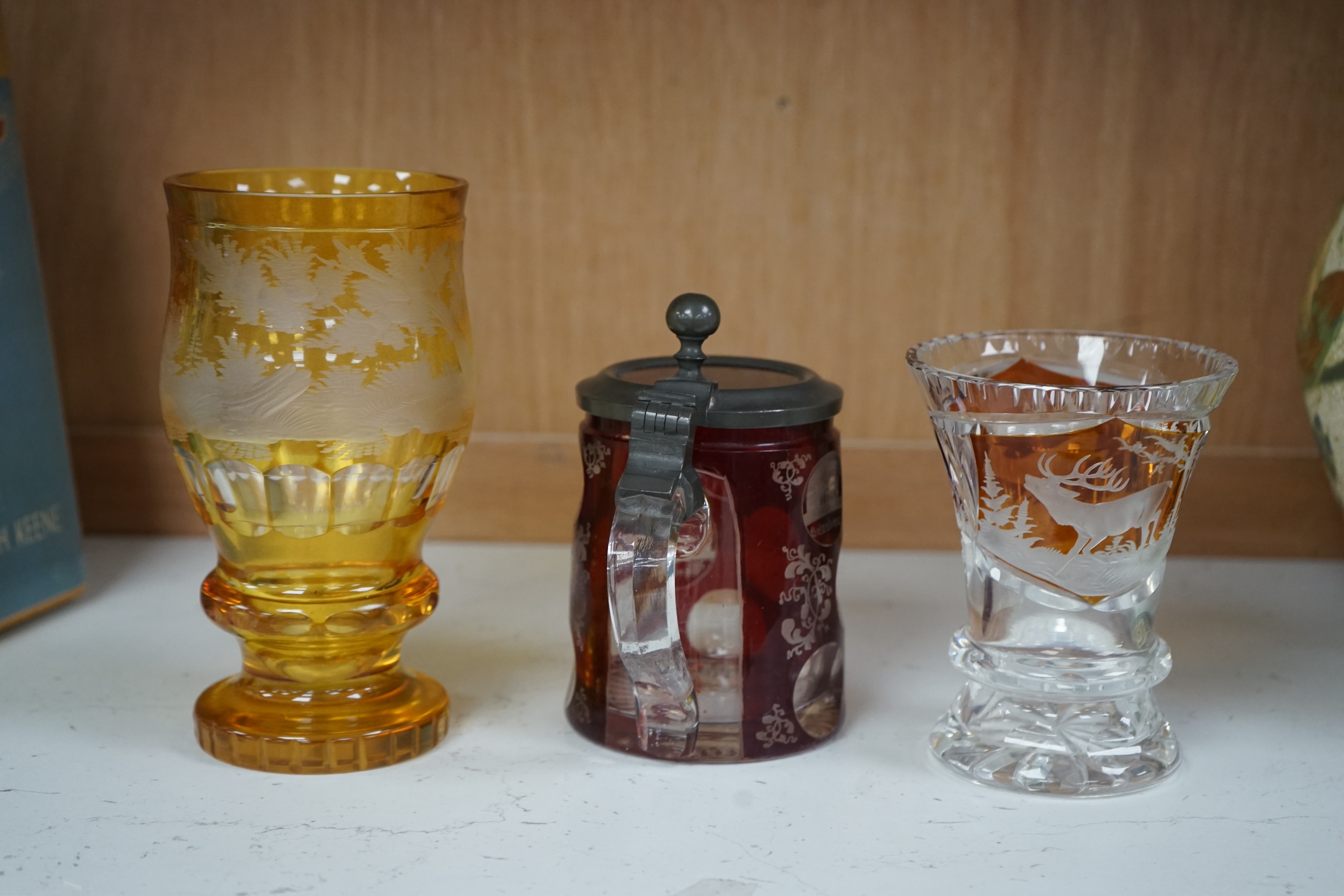 Two 19th century Bohemian glasses and a similar tankard, amber glass 15cm high. Condition - good